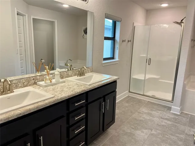 a bathroom with a bathtub and shower