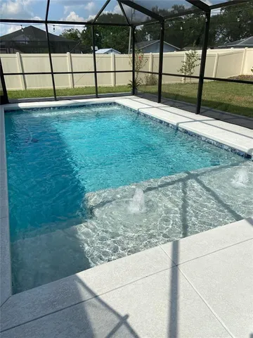 a view of a chairs and table in the patio