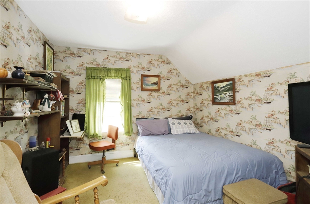 5 Anthony Street Acushnet, MA 02743 - Photo 28 of 37 a bedroom with a bed and a flat screen tv