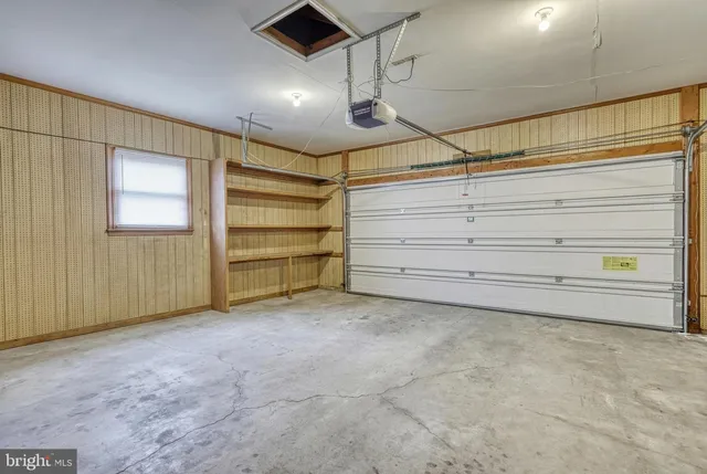 an aerial view of a house with a garden