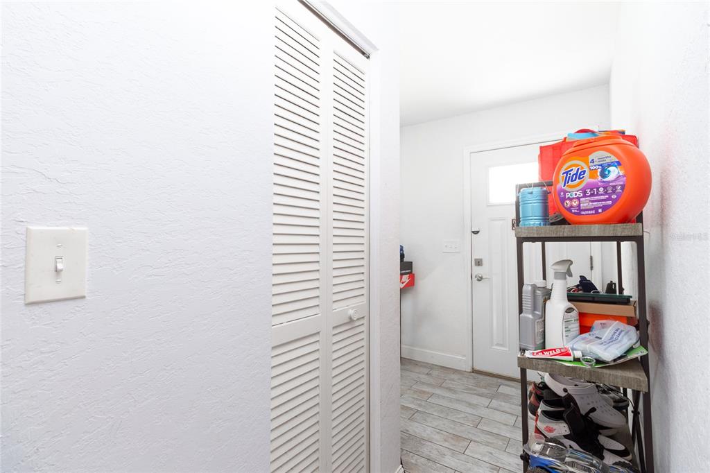 6447 Brandy Drive Spring Hill, FL 34607 - Photo 12 of 25 a very nice looking room with a white wall and a painting