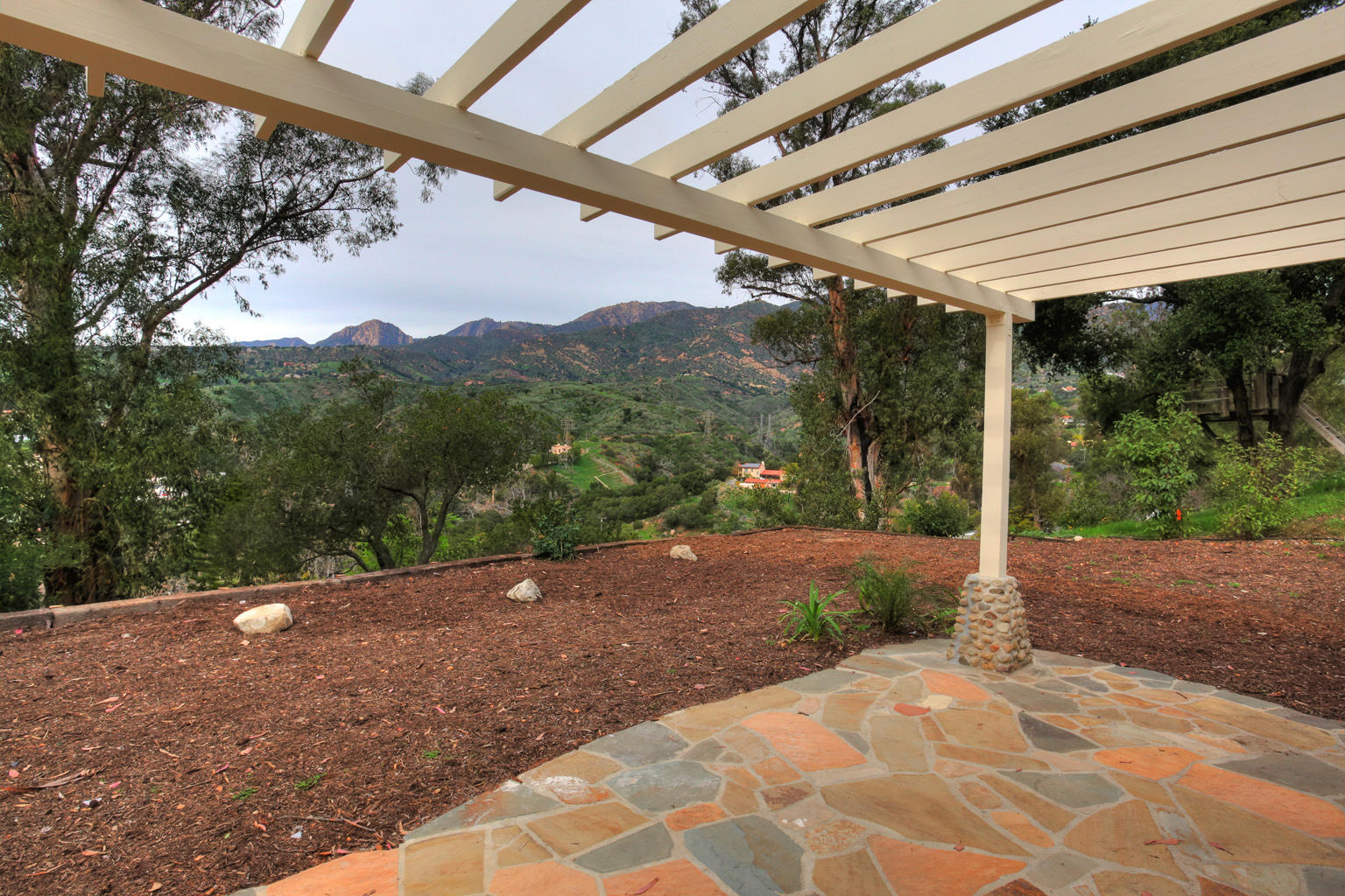 75 Canon View Road Santa Barbara, CA 93108 - Photo 2 of 31 a view of a backyard with green space