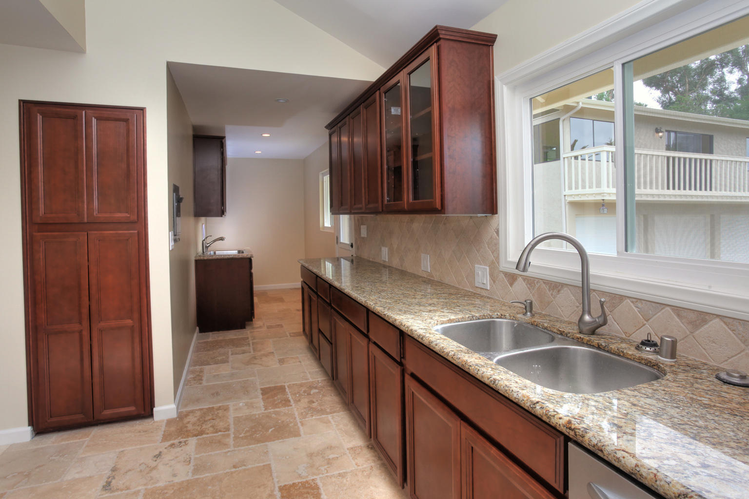 75 Canon View Road Santa Barbara, CA 93108 - Photo 6 of 31 a kitchen with a sink and cabinets