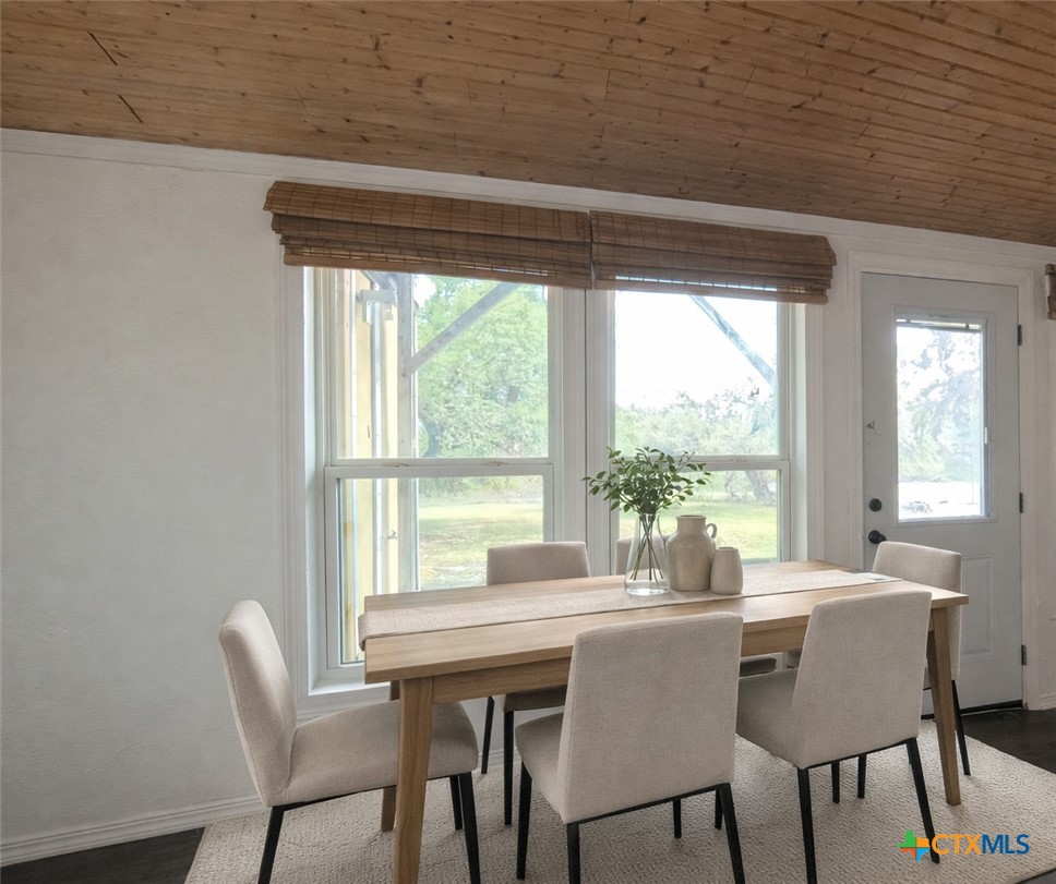929 Red Bluff Ranch Road Pipe Creek, TX 78063 - Photo 11 of 39 a dining room with furniture and window