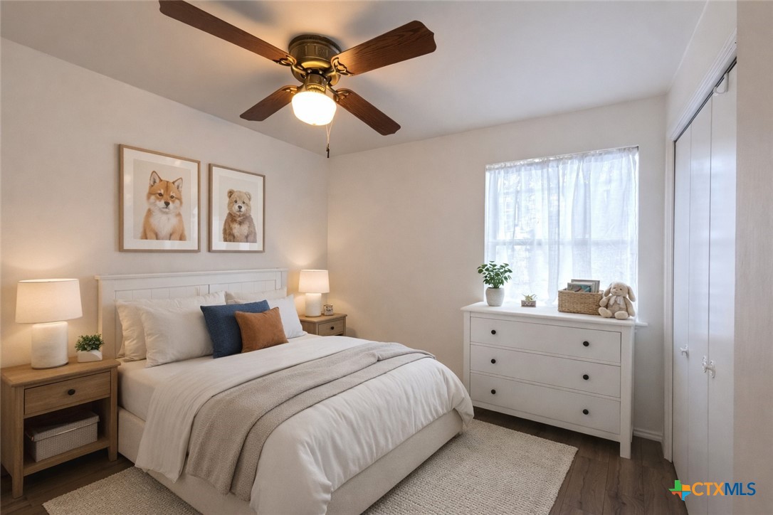 929 Red Bluff Ranch Road Pipe Creek, TX 78063 - Photo 13 of 39 a bedroom with a large bed and a window