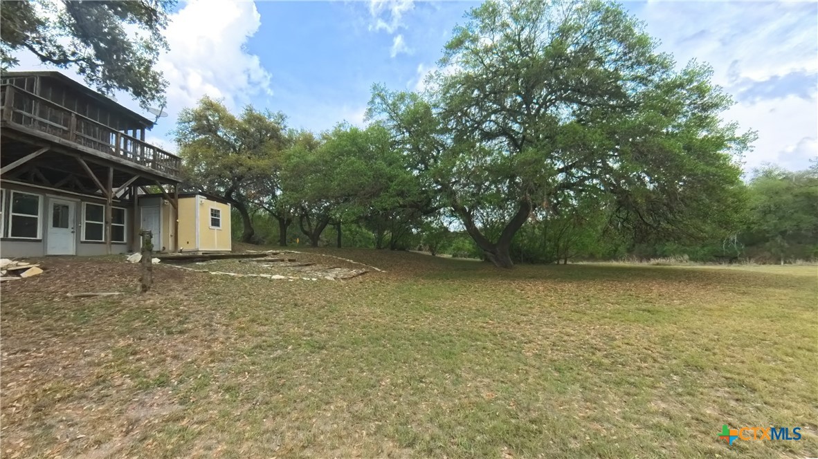 929 Red Bluff Ranch Road Pipe Creek, TX 78063 - Photo 31 of 39 a backyard of a house with lots of green space