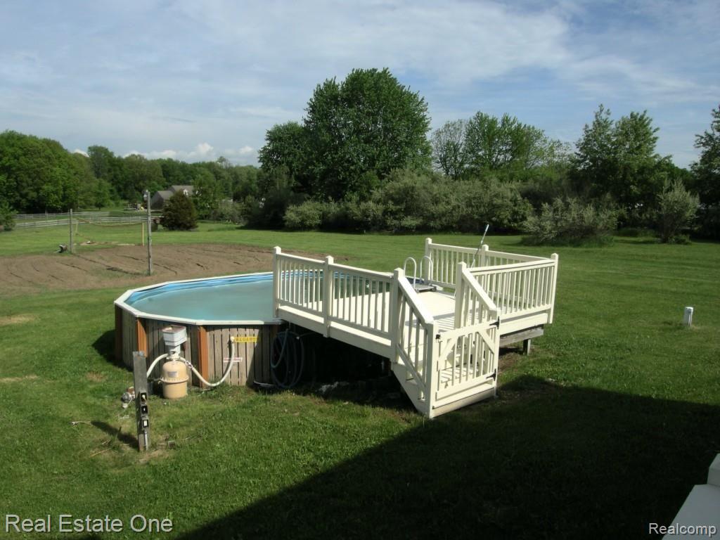 6974 Fish Lake Road Holly, MI 48442 - Photo 42 of 51 Volley Ball Court & Pool