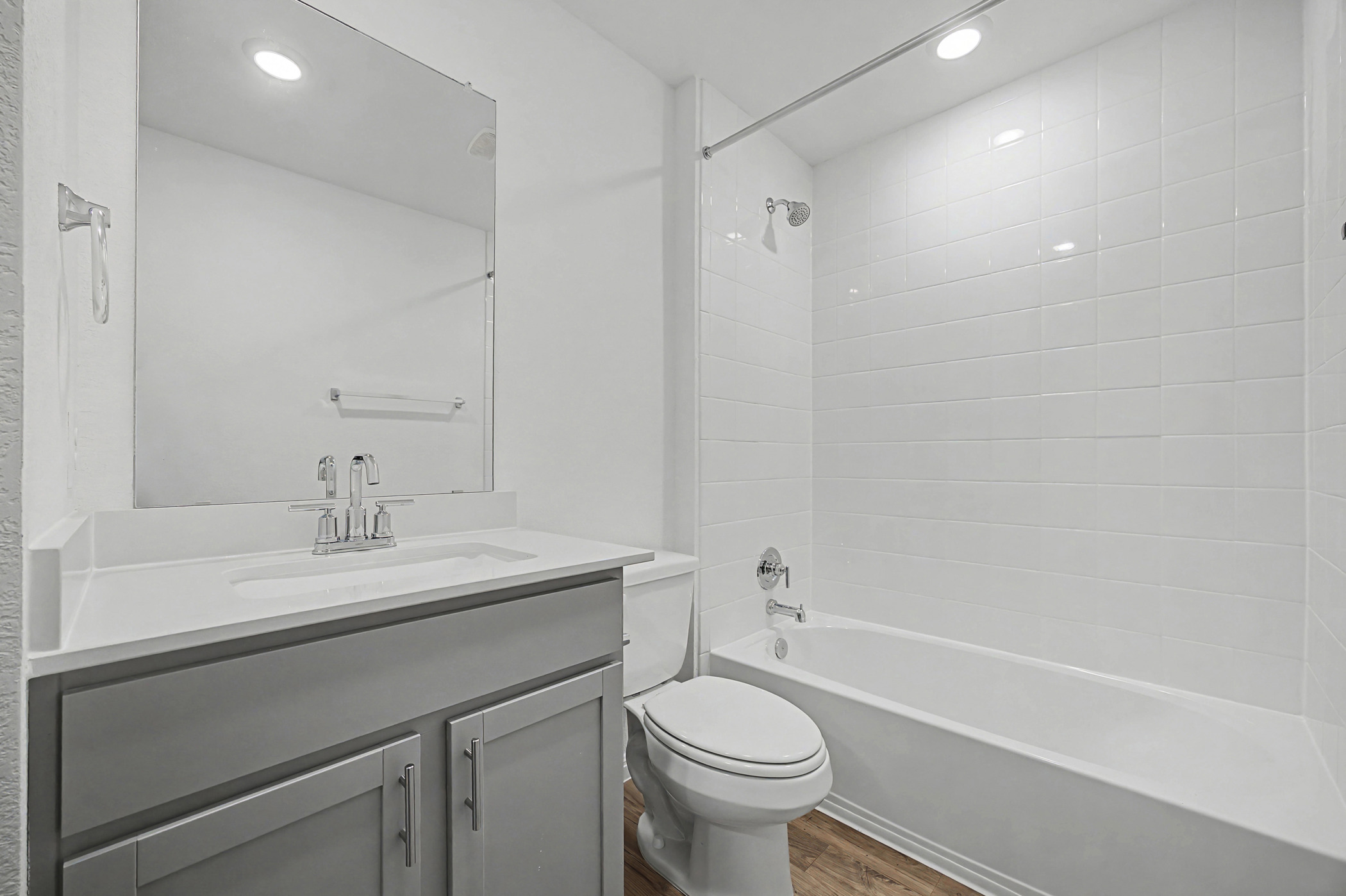 1908 Pogonip Place Leander, TX 78641 - Photo 11 of 21 Full bathroom with shower / bath combination, vanity, dark wood-style flooring, and recessed lighting