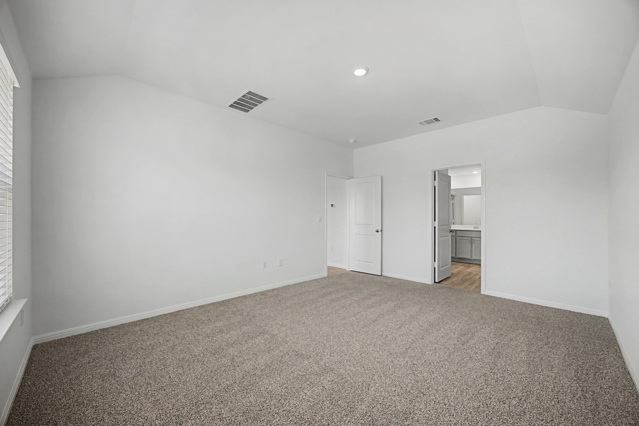 1908 Pogonip Place Leander, TX 78641 - Photo 16 of 21 Unfurnished bedroom featuring lofted ceiling and carpet