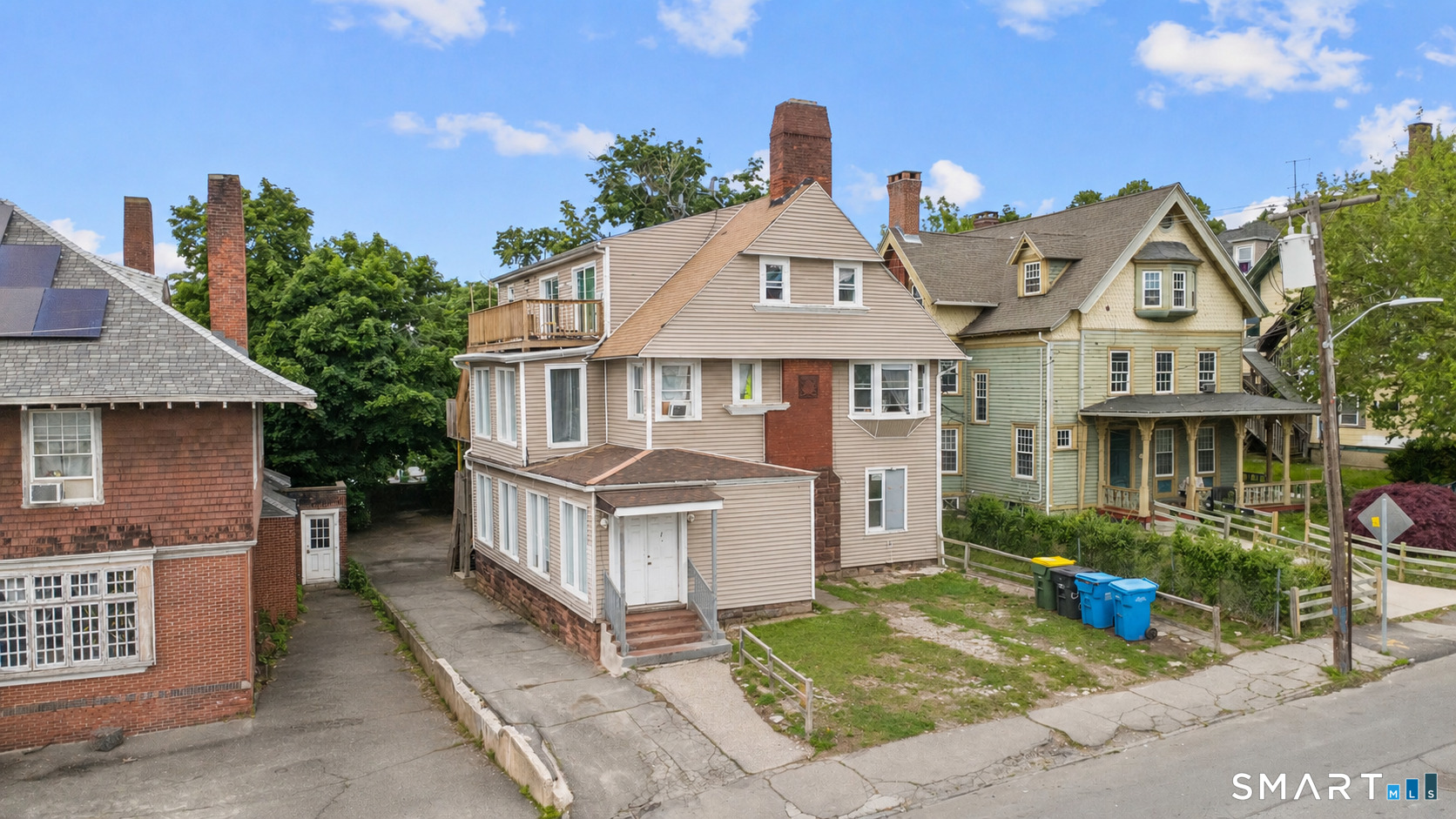 135 Prospect Street Waterbury, CT 06710 - Photo 1 of 19 a front view of a house with garden