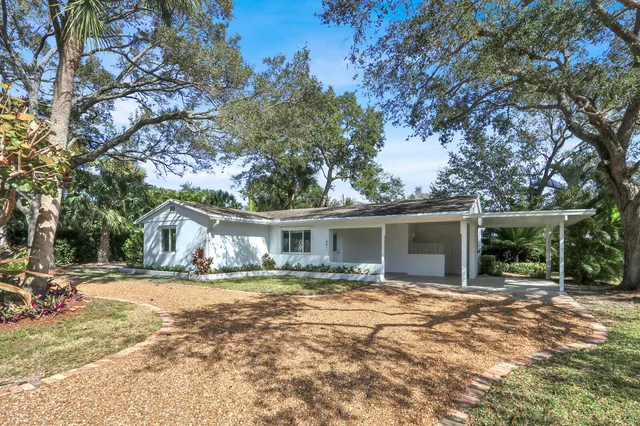 a view of house with yard