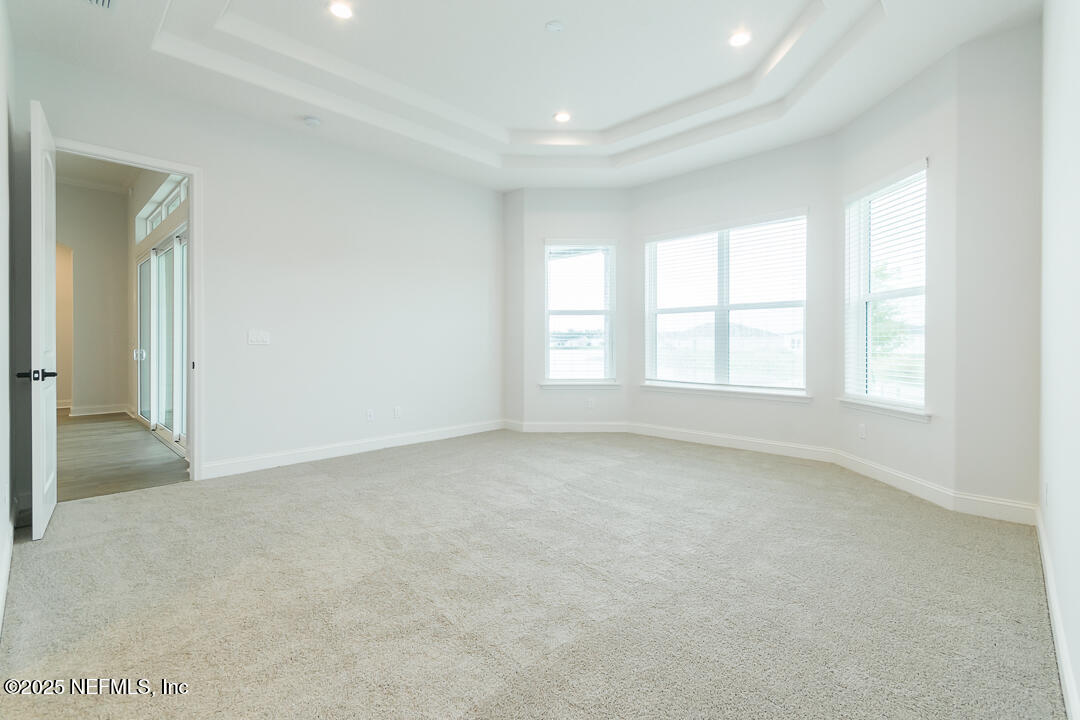 303 Eagle Moon Lake Drive St. Augustine, FL 32092 - Photo 19 of 35 an empty room with windows