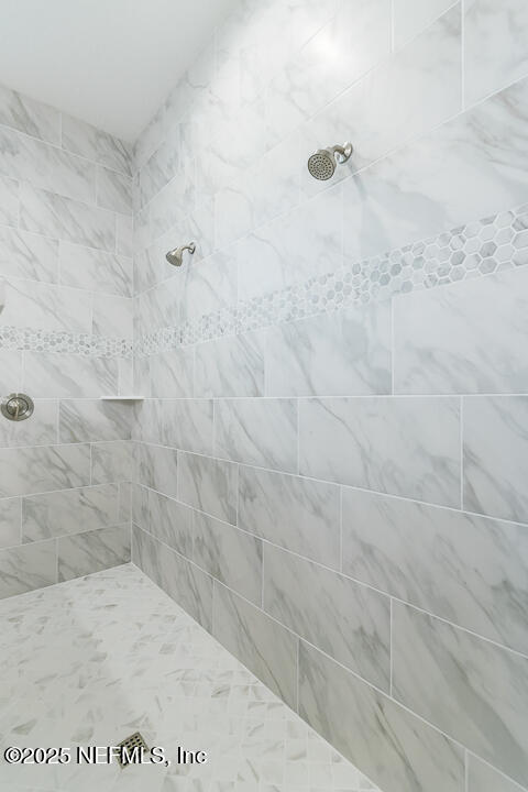 303 Eagle Moon Lake Drive St. Augustine, FL 32092 - Photo 24 of 35 a bathroom with a shower