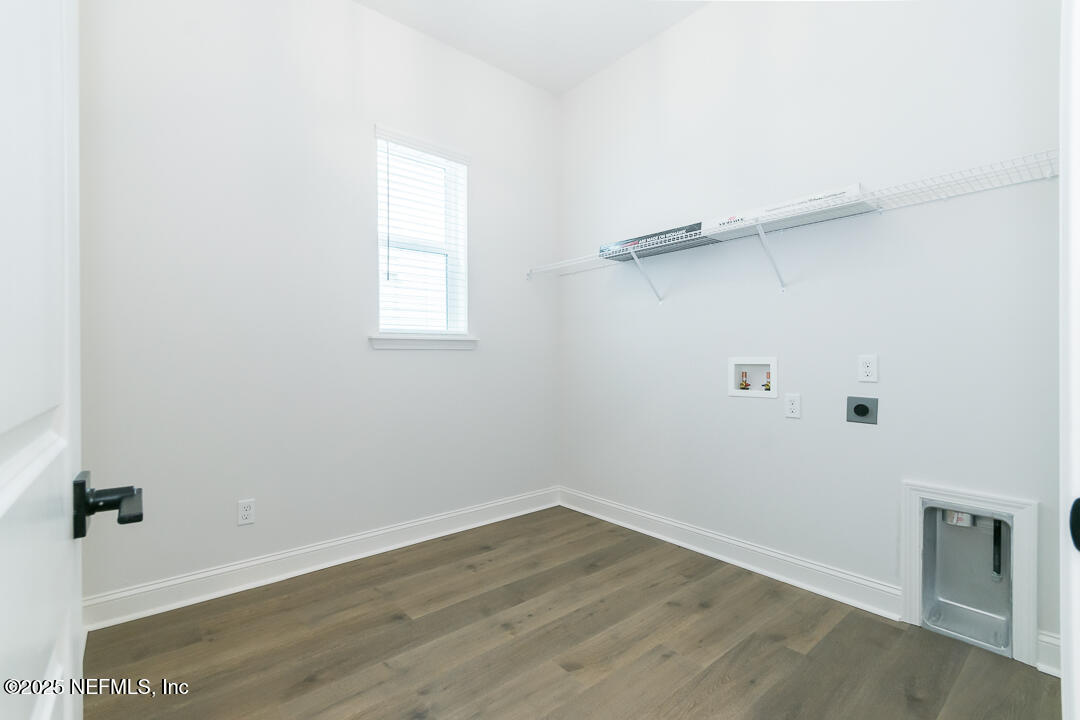 303 Eagle Moon Lake Drive St. Augustine, FL 32092 - Photo 29 of 35 wooden floor in an empty room