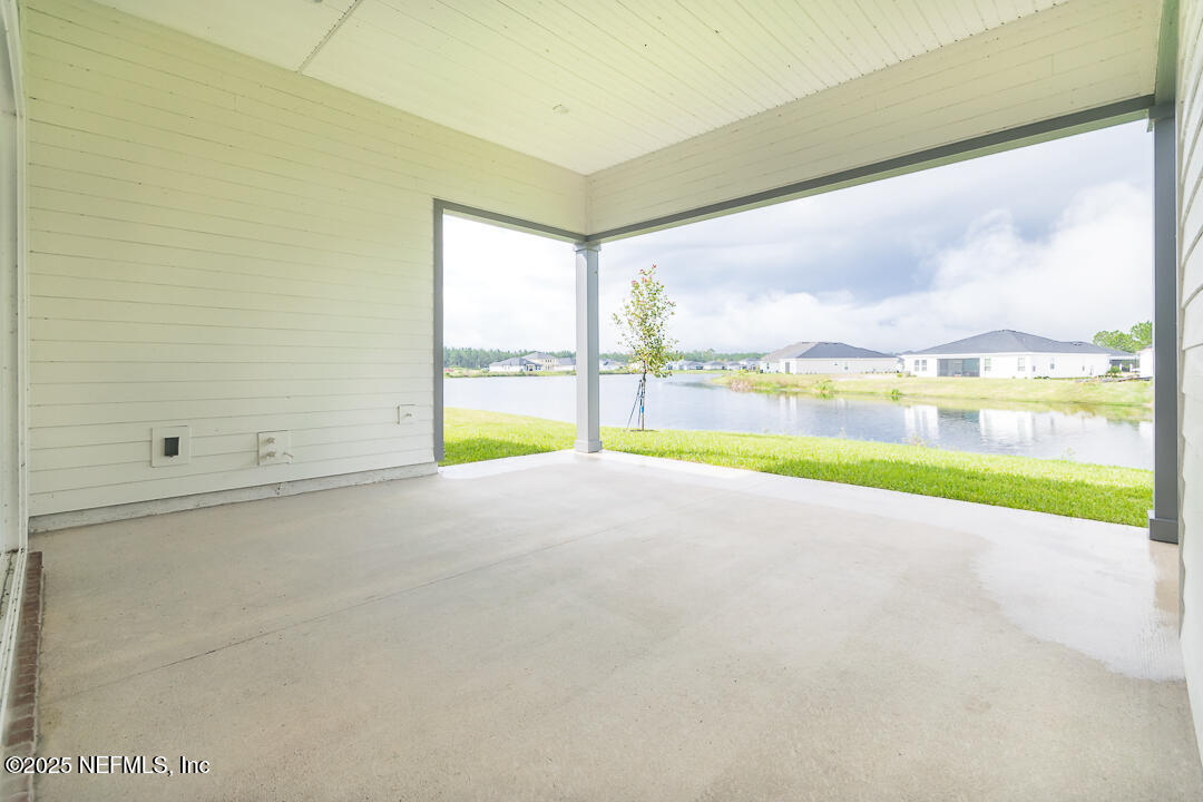 303 Eagle Moon Lake Drive St. Augustine, FL 32092 - Photo 30 of 35 a view of a room with an empty space and swimming pool