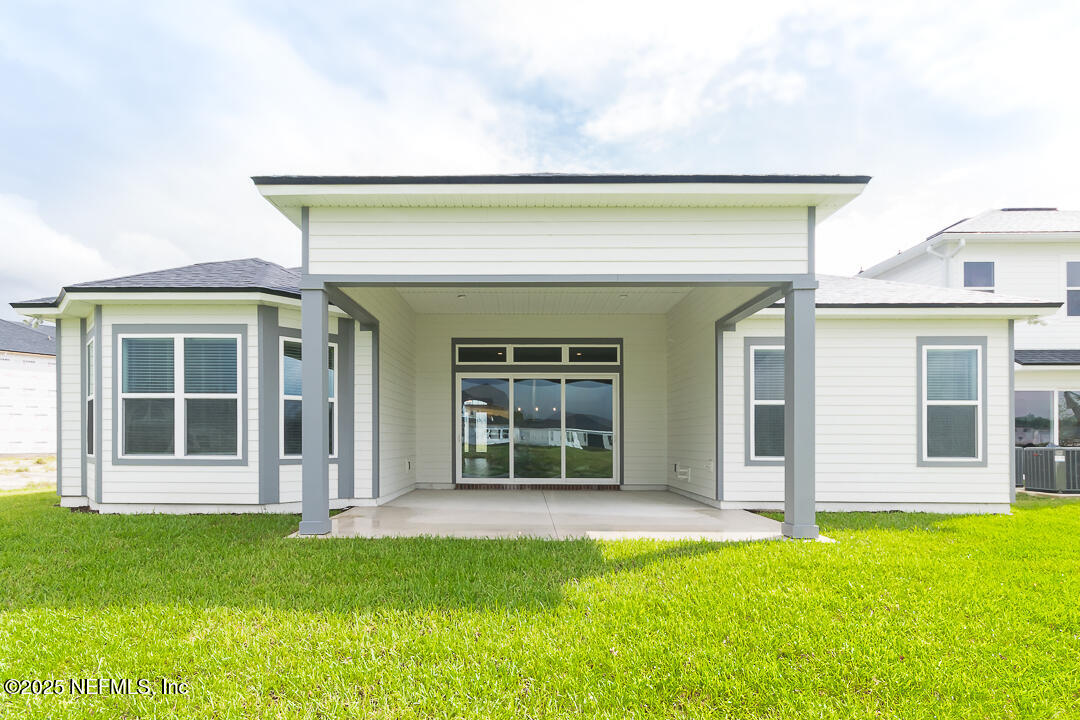 303 Eagle Moon Lake Drive St. Augustine, FL 32092 - Photo 32 of 35 front view of a house with a yard