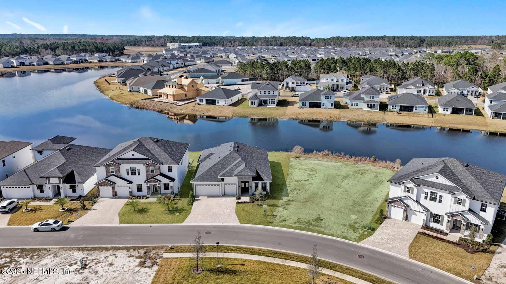 303 Eagle Moon Lake Drive St. Augustine, FL 32092 - Photo 34 of 35 an aerial view of residential houses with outdoor space