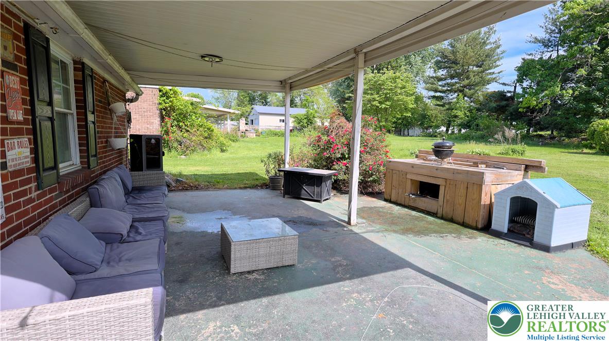 1345 Macada Road Bethlehem, PA 18017 - Photo 21 of 23 a living room with patio furniture and a fireplace