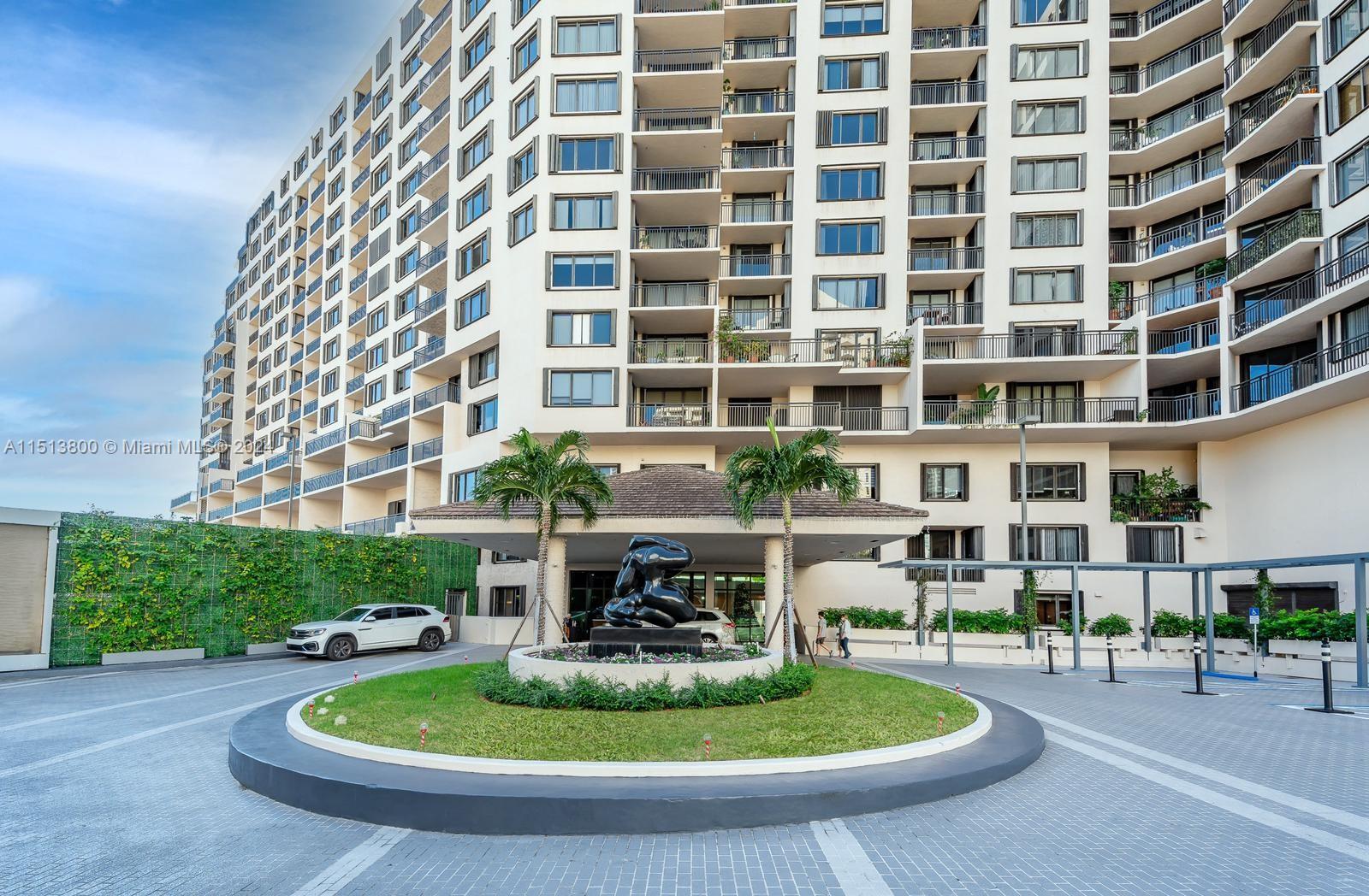 540 Brickell Key Drive, Unit 905 Miami, FL 33131 - Photo 1 of 43 a view of a building with a garden and plants