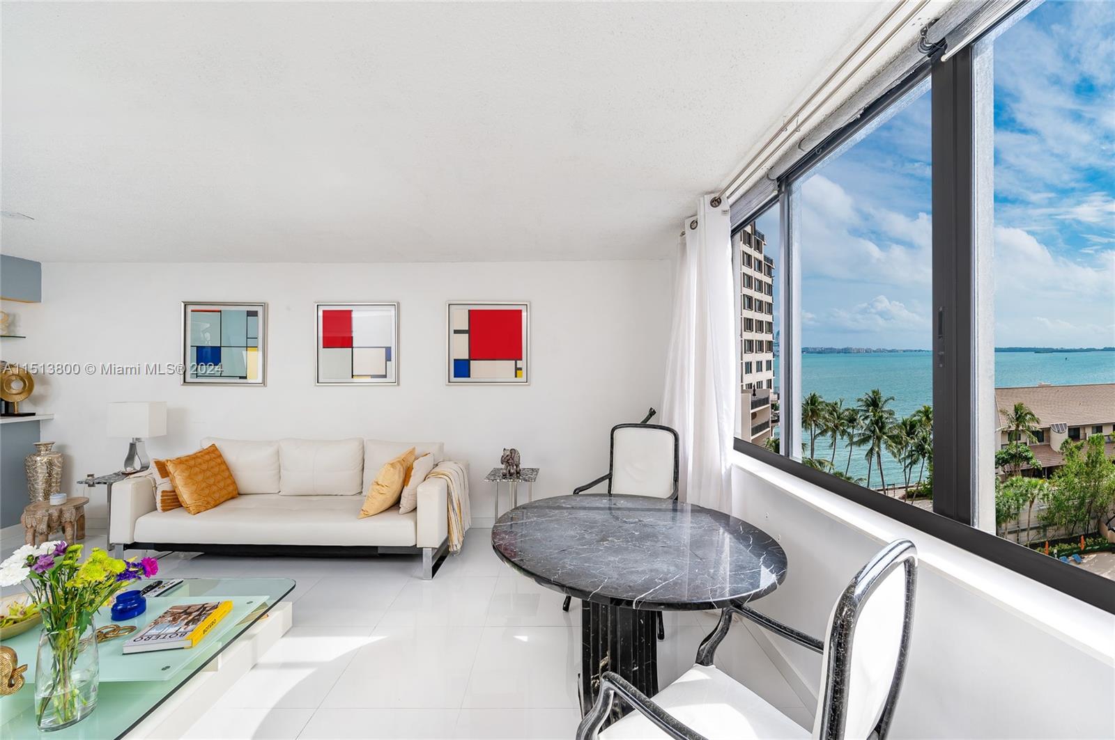 540 Brickell Key Drive, Unit 905 Miami, FL 33131 - Photo 11 of 43 a living room with furniture and window