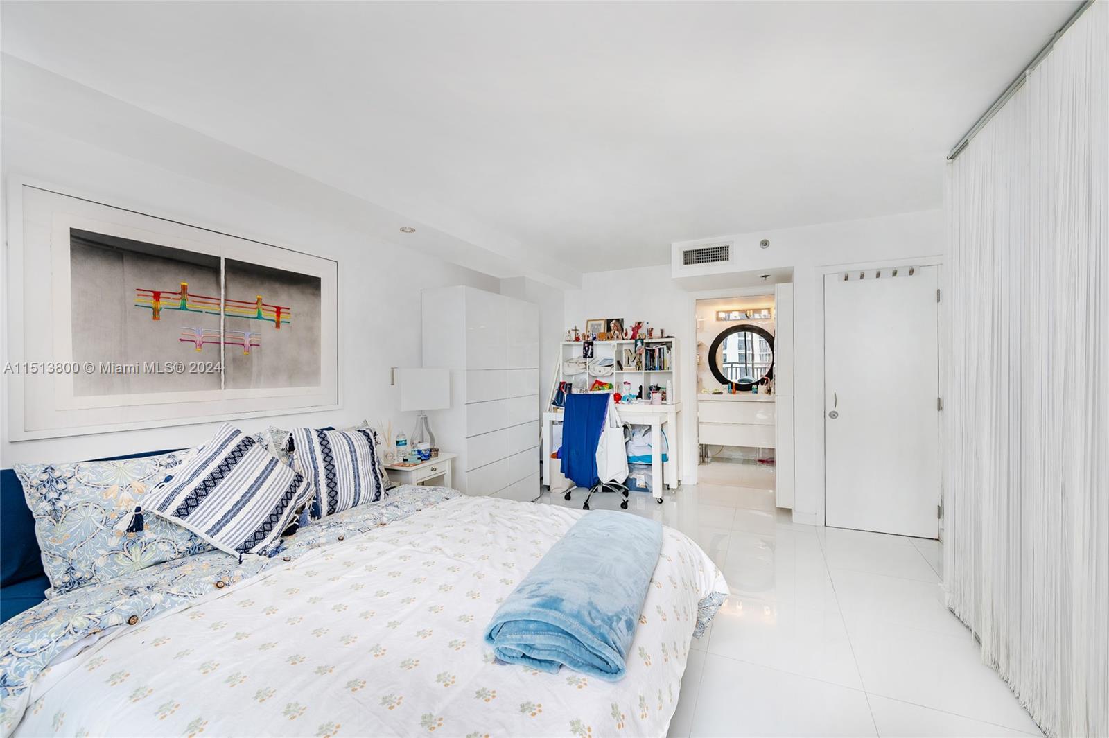 540 Brickell Key Drive, Unit 905 Miami, FL 33131 - Photo 16 of 43 a bedroom with furniture and a bed