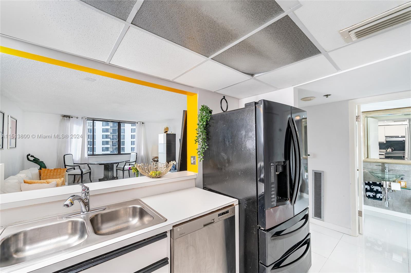 540 Brickell Key Drive, Unit 905 Miami, FL 33131 - Photo 19 of 43 a kitchen with stainless steel appliances a sink and a refrigerator
