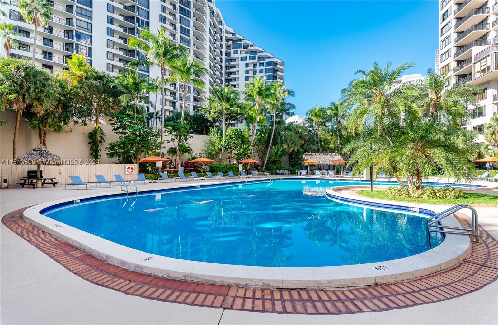 540 Brickell Key Drive, Unit 905 Miami, FL 33131 - Photo 27 of 43 a view of a swimming pool with a yard