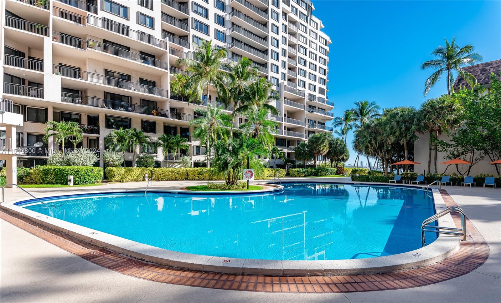 540 Brickell Key Drive, Unit 905 Miami, FL 33131 - Photo 28 of 43 a view of a swimming pool with a lounge chairs