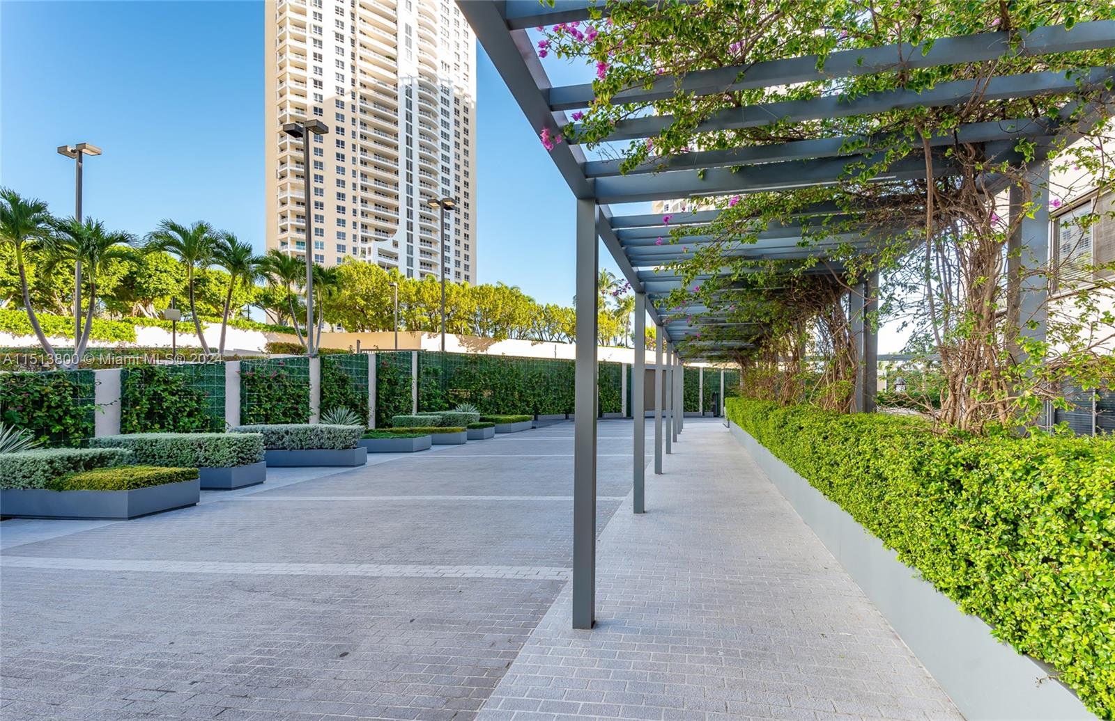 540 Brickell Key Drive, Unit 905 Miami, FL 33131 - Photo 7 of 43 a view of a park with plants and palm trees