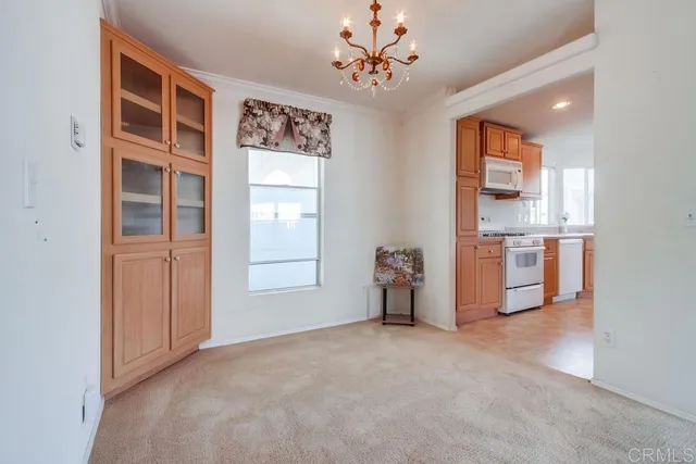 a view of livingroom with hardwood floor and workspace