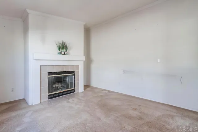 a view of a room with window and fireplace