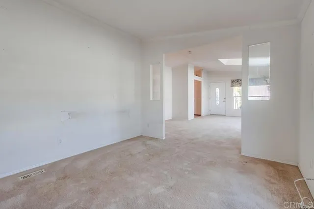 a view of a room with closet and mirror