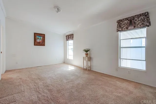 a view of empty room with windows