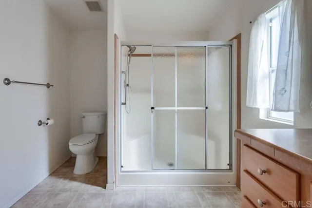 a bathroom view of a toilet and a sink