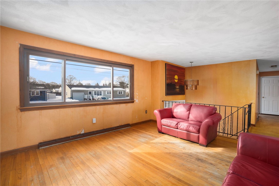 247 Asylum Road Warwick, RI 02886 - Photo 2 of 17 Living room with hardwoods and fireplace
