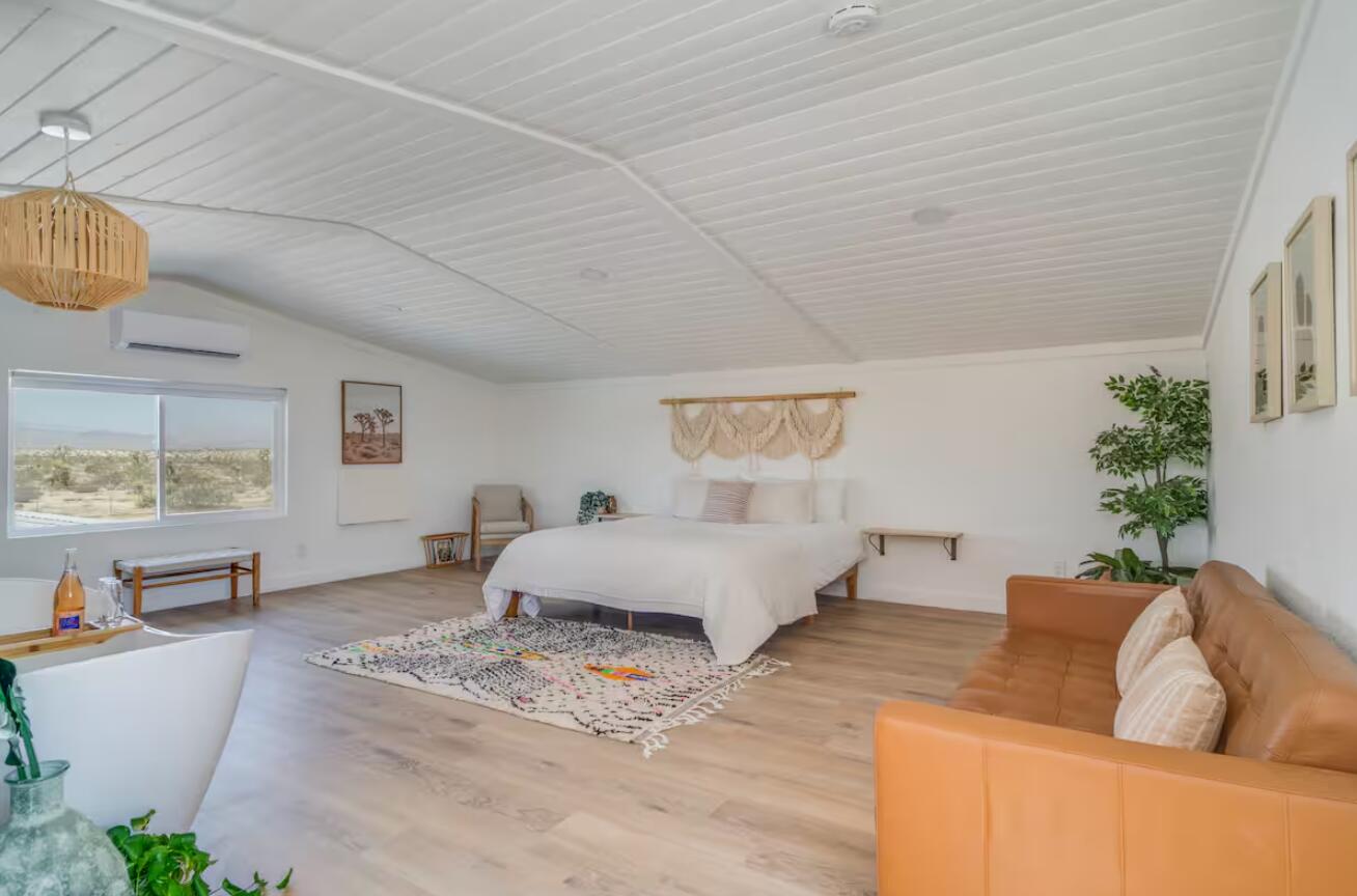 57725 Junipero Trail Yucca Valley, CA 92284 - Photo 2 of 46 a living room with furniture and a couch