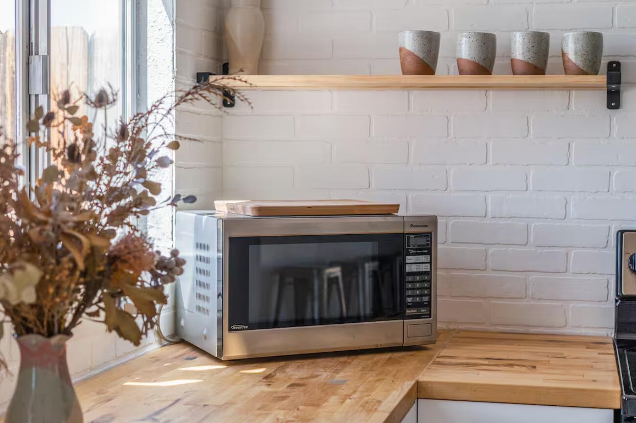 57725 Junipero Trail Yucca Valley, CA 92284 - Photo 22 of 46 a white stove top oven sitting inside of a kitchen