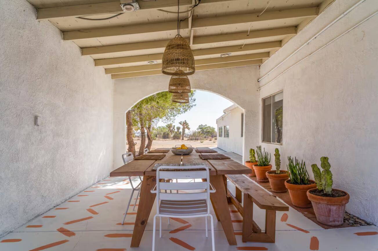 57725 Junipero Trail Yucca Valley, CA 92284 - Photo 36 of 46 a view of a living room and a chandelier