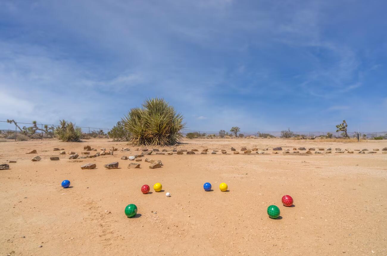 57725 Junipero Trail Yucca Valley, CA 92284 - Photo 40 of 46 a view of kitchen island with furniture and refrigerator in it