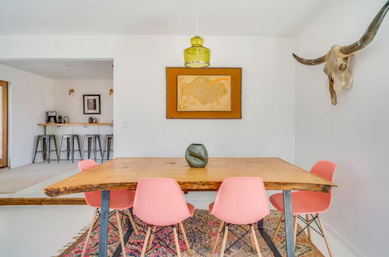 57725 Junipero Trail Yucca Valley, CA 92284 - Photo 4 of 46 a view of a dining room with furniture and wooden floor