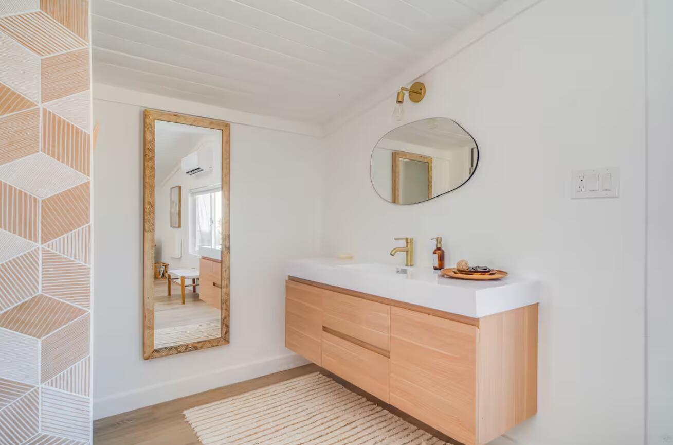 57725 Junipero Trail Yucca Valley, CA 92284 - Photo 9 of 46 a bathroom with a sink a mirror and vanity