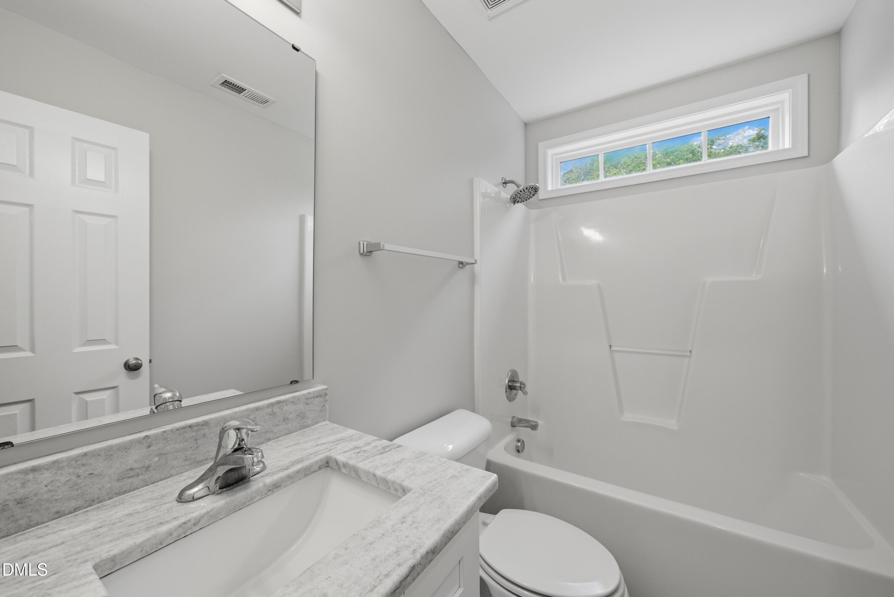 201 Tonylee Court, Unit A Raleigh, NC 27603 - Photo 26 of 30 a bathroom with a sink toilet and shower