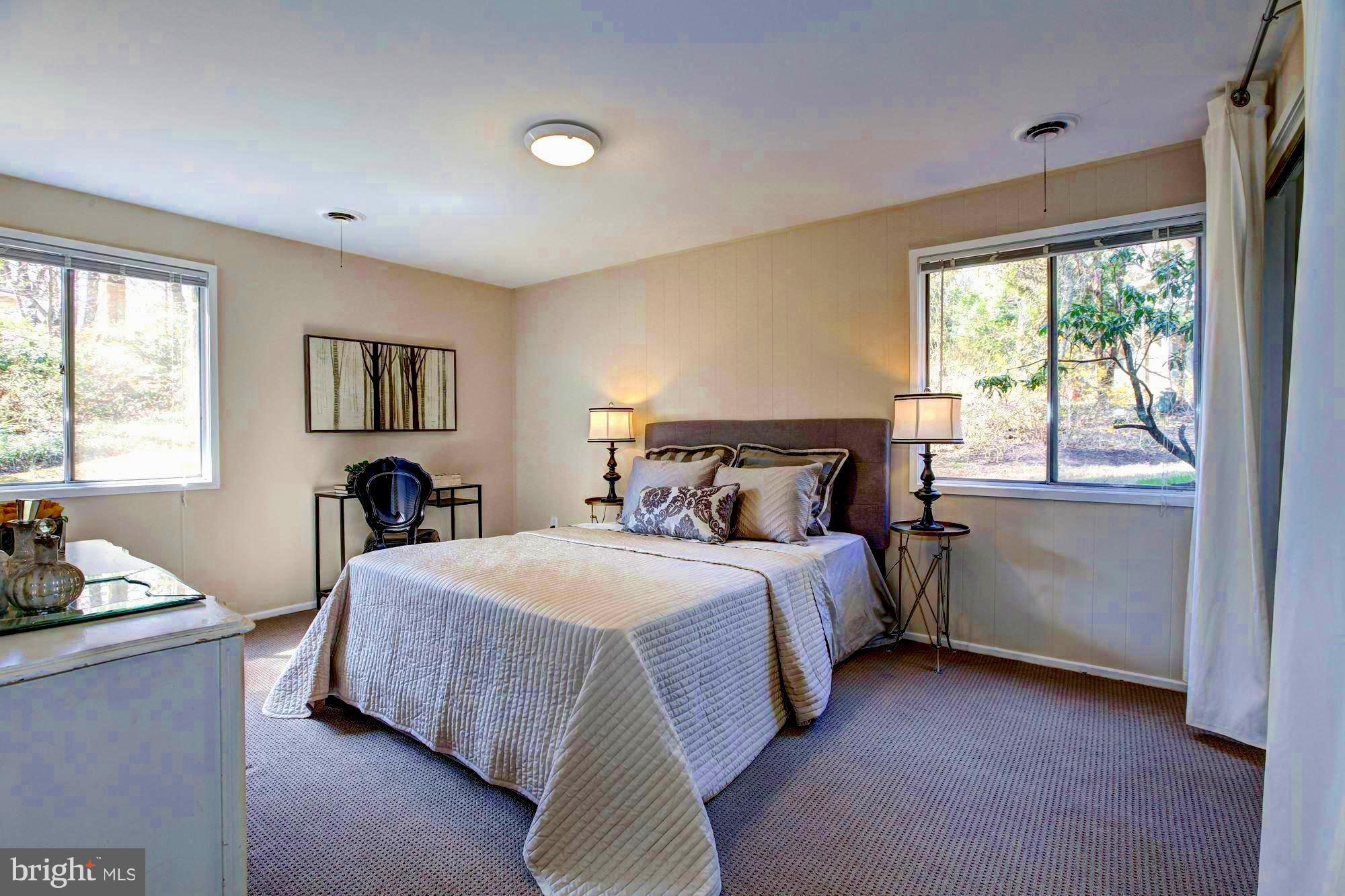 7904 Hamilton Spring Road Bethesda, MD 20817 - Photo 20 of 30 An elegant bedroom with light from all angles