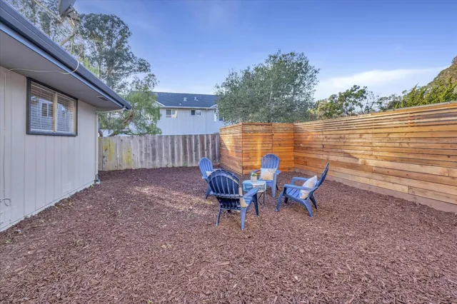 a view of a lake with outdoor seating