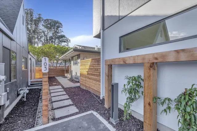 a view of a house with a potted plant
