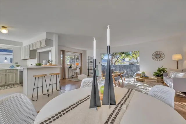 a living room with furniture and a table