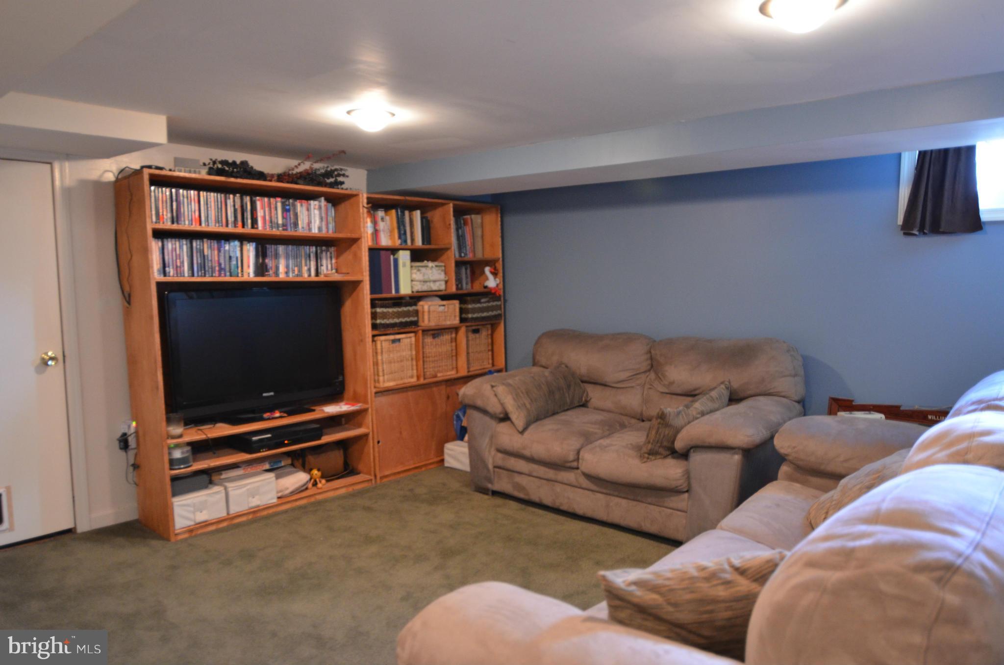 600 Old Riverside Road Baltimore, MD 21225 - Photo 7 of 15 a living room with furniture and a flat screen tv