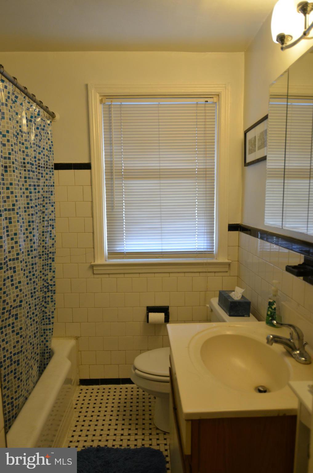 600 Old Riverside Road Baltimore, MD 21225 - Photo 8 of 15 a bathroom with a sink and a shower