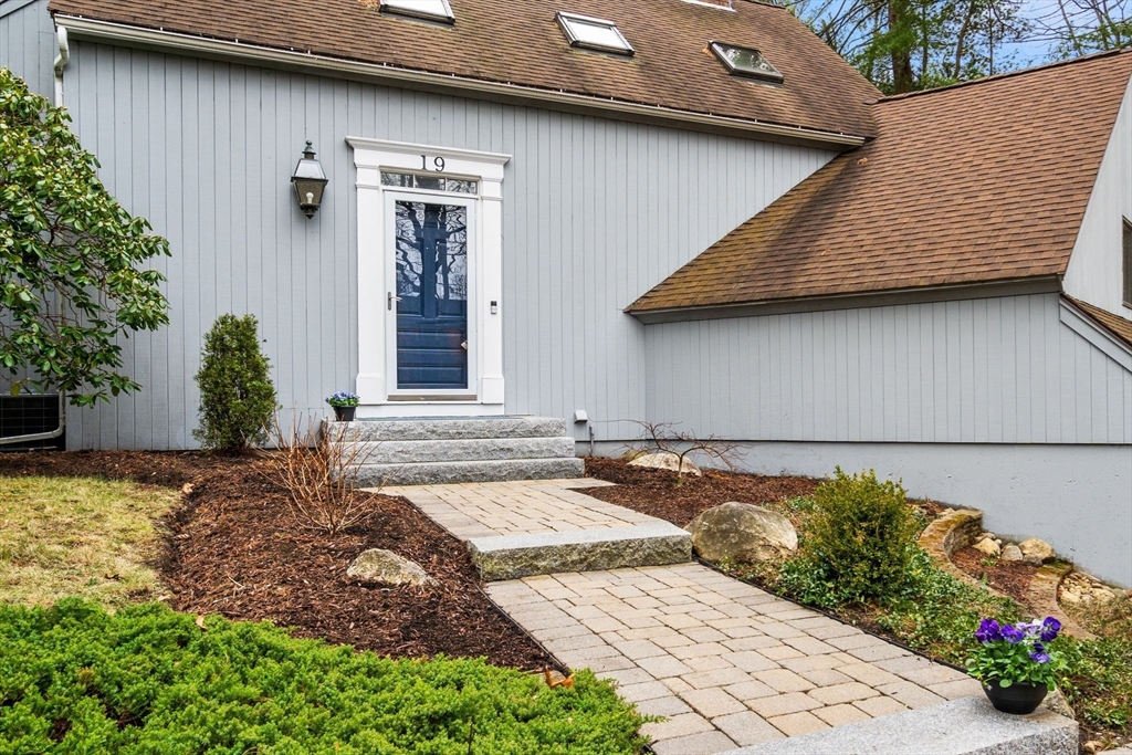 19 Stinson Road Andover, MA 01810 - Photo 3 of 40 a view of a backyard with pathway