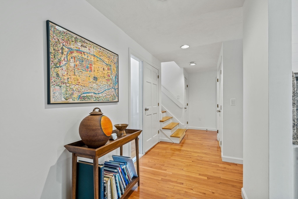 19 Stinson Road Andover, MA 01810 - Photo 7 of 40 a sitting area with furniture and wooden floor